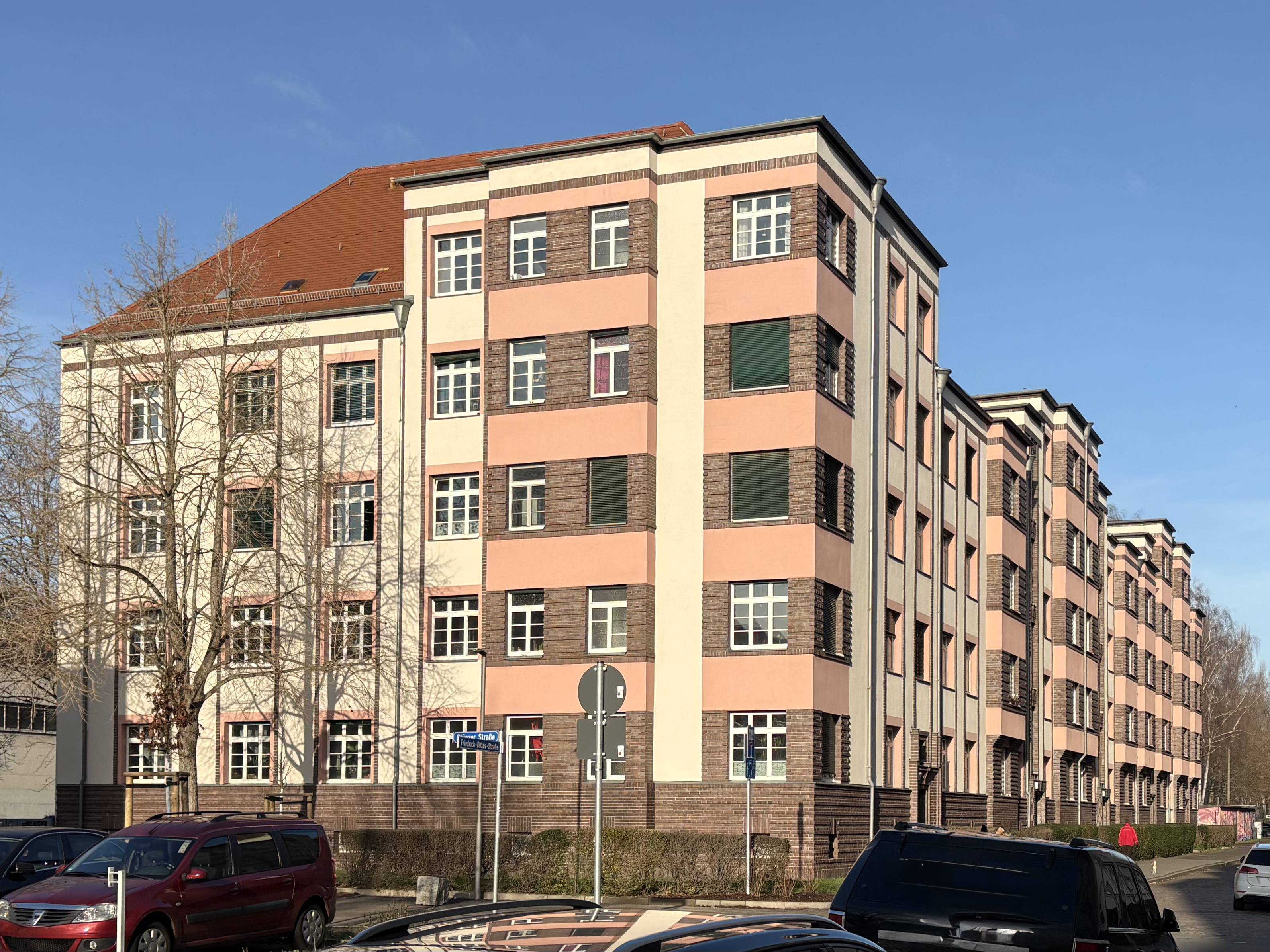 Apartment building from 1930 with a mix of gable and flat roofs