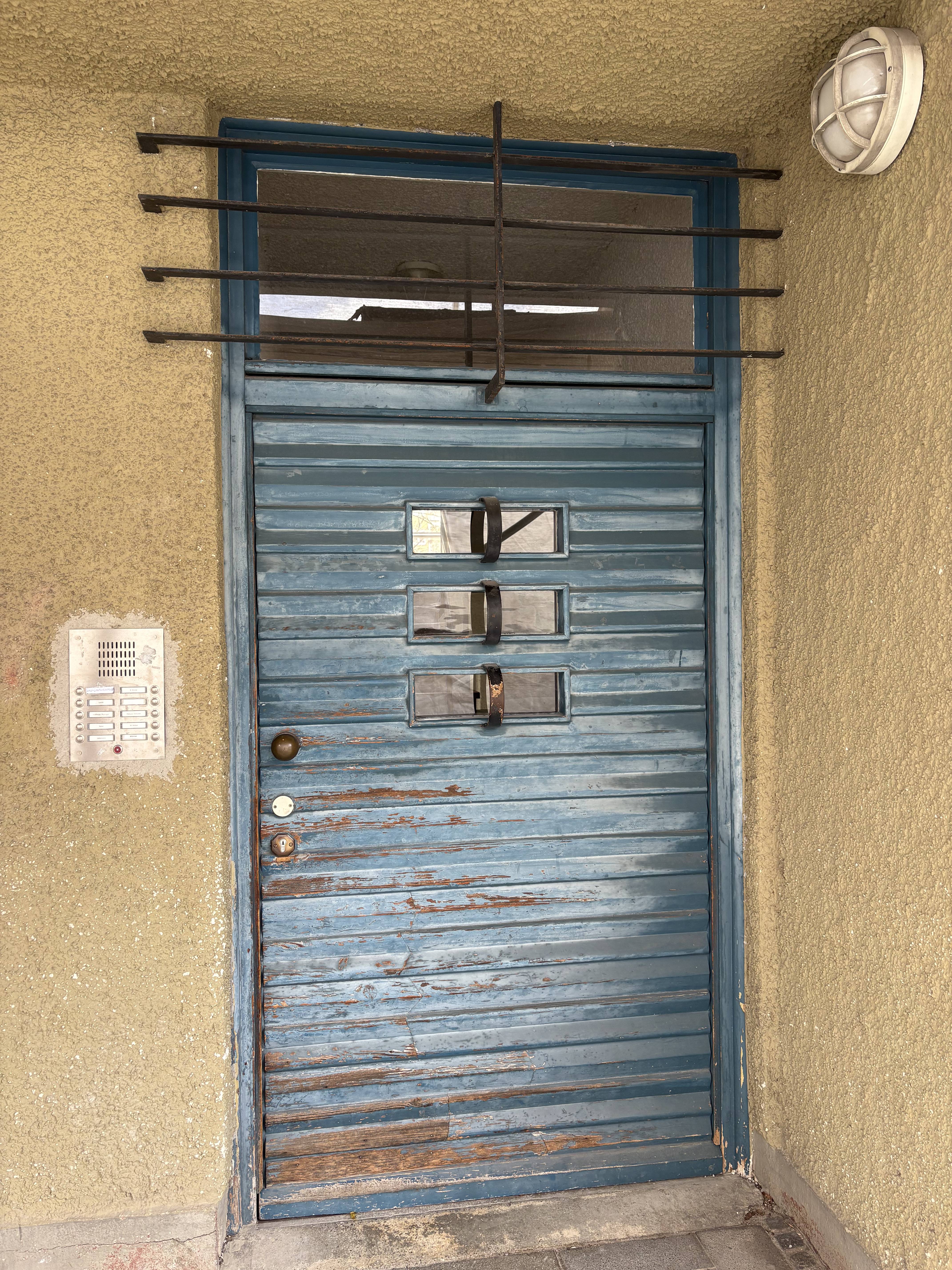 Blue painted wood and metal bar ornamentation