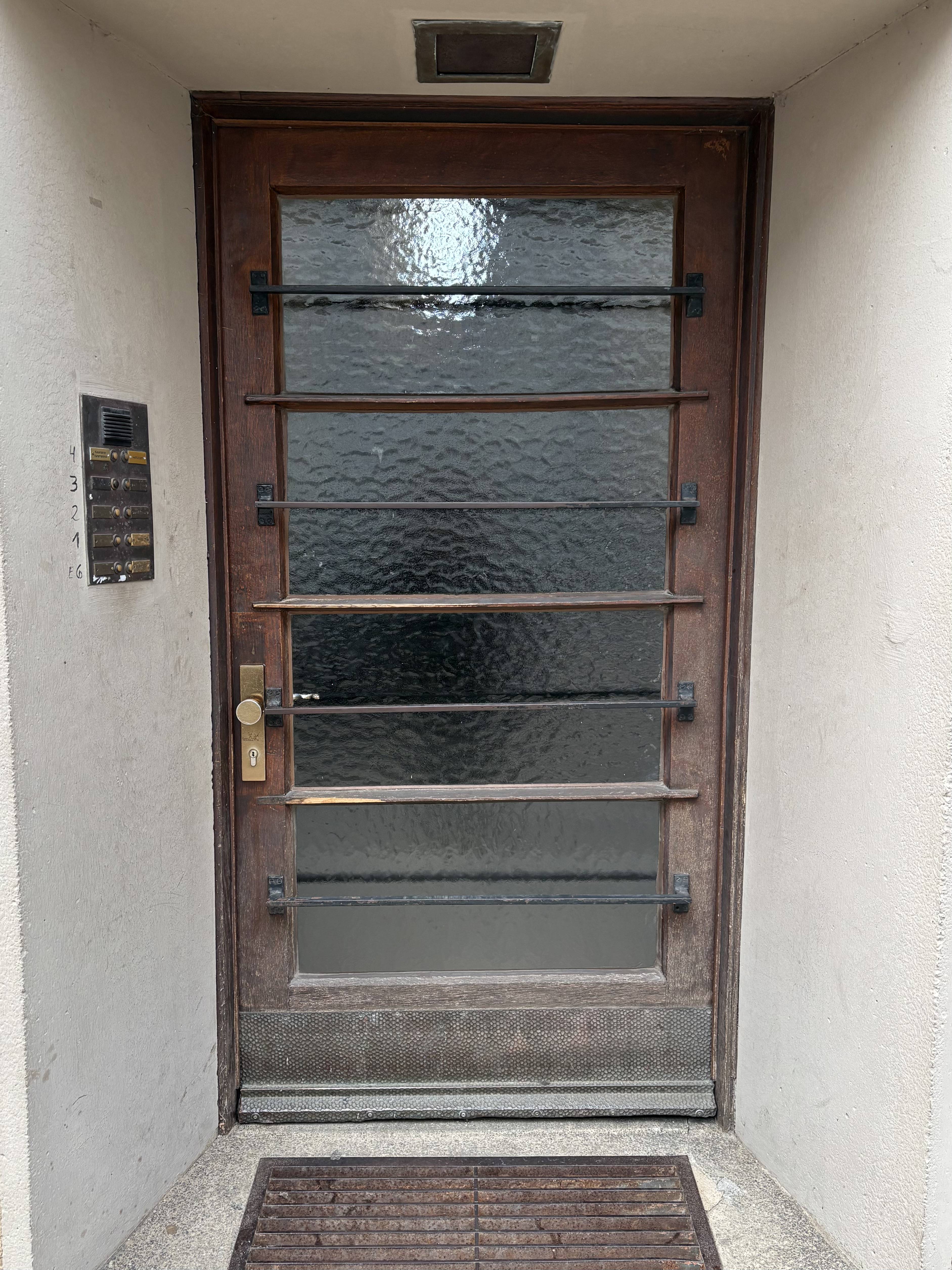 Wood separating glass panes and decorative metal bars